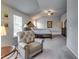 Luxurious main bedroom suite featuring a sitting area and a spacious bedroom area at 7214 Gladstone Cir, Stonecrest, GA 30038