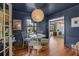 Cozy dining area with a round table, stylish chairs, hardwood floors and decorative lighting fixture at 496 Overbrook Nw Dr, Atlanta, GA 30318