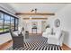 Well-lit living room boasts hardwood floors and exposed beam ceilings at 496 Overbrook Nw Dr, Atlanta, GA 30318