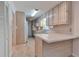 Kitchen boasts ample counter space and a breakfast bar at 1428 Ridgewood Sw Dr, Lilburn, GA 30047