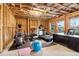 Basement with exposed framing and utilities featuring exercise equipment and a desk at 3329 Stetson Overlook Se, Smyrna, GA 30080