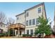 Exterior view of the home showcasing a wooden deck and covered patio overlooking the backyard at 3329 Stetson Overlook Se, Smyrna, GA 30080