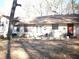 Home's backyard with patio and trees at 6656 Mitchell Sw Ln, Mableton, GA 30126