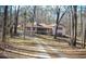 Ranch home nestled in a wooded lot with a long driveway at 6656 Mitchell Sw Ln, Mableton, GA 30126