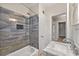 Bathroom featuring modern tiling, a tub/shower, a sink and vanity and a view of the hallway at 2627 Elsinore St, East Point, GA 30344