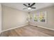 Bedroom with hardwood flooring and a backyard view from the multiple windows at 2627 Elsinore St, East Point, GA 30344