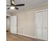 Bedroom with hardwood flooring and a ceiling fan and closet space at 2627 Elsinore St, East Point, GA 30344