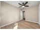 Bedroom featuring a ceiling fan, hardwood floors, and a connecting doorway at 2627 Elsinore St, East Point, GA 30344