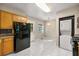 Bright kitchen and laundry featuring modern appliances, marble floors, and ample cabinet space at 2627 Elsinore St, East Point, GA 30344