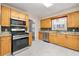 Updated kitchen with stainless steel appliances and ample cabinet space at 2627 Elsinore St, East Point, GA 30344
