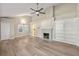 Spacious living room featuring a fireplace, built-in shelving, and hardwood floors at 2627 Elsinore St, East Point, GA 30344