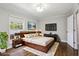 Bedroom with a large bed, a dresser, and a window at 5566 Kingsport Dr, Atlanta, GA 30342