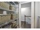 Spacious closet with wire shelving and wicker baskets for storage at 5566 Kingsport Dr, Atlanta, GA 30342