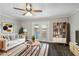 Living room with modern furniture, dark floors, and natural light at 5566 Kingsport Dr, Atlanta, GA 30342