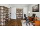 Office space with hardwood floors, bookshelves, and a work desk at 5566 Kingsport Dr, Atlanta, GA 30342