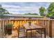 Relaxing outdoor patio featuring a wood table, chairs and privacy fence at 5566 Kingsport Dr, Atlanta, GA 30342