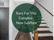 Staircase with wood treads and white risers at 5566 Kingsport Dr, Atlanta, GA 30342