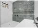 Bathroom with soaking tub and gray marble tile at 1674 Union Grove Church Rd, Auburn, GA 30011