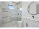 Modern bathroom with a walk-in shower, white vanity, and a large mirror at 1674 Union Grove Church Rd, Auburn, GA 30011