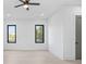 Bright bedroom with wood flooring, ceiling fan, and large windows at 1674 Union Grove Church Rd, Auburn, GA 30011