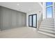 Bright entryway with gray wall paneling and modern staircase at 1674 Union Grove Church Rd, Auburn, GA 30011