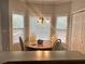 Bright dining area with natural light, a chandelier, and an adjacent closet at 5821 Saint Miles Dr, Buford, GA 30518