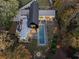 Aerial view of estate featuring home with a pool, patio and fire pit surrounded by mature trees at 2716 Ridgewood Nw Rd, Atlanta, GA 30327