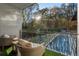 Tranquil balcony overlooking the backyard, featuring a pool and seating area at 2716 Ridgewood Nw Rd, Atlanta, GA 30327