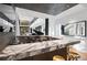 Stylish bar area with marble countertop, modern bar stools, and open view into the living room at 2716 Ridgewood Nw Rd, Atlanta, GA 30327