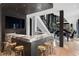 Stylish bar area with marble countertop, modern bar stools, and open view into the living room at 2716 Ridgewood Nw Rd, Atlanta, GA 30327
