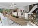 Modern dining room with a glass top table, bright white chairs, and backyard views at 2716 Ridgewood Nw Rd, Atlanta, GA 30327