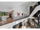 Open foyer showcasing modern staircase, artwork, piano, and views of the living spaces at 2716 Ridgewood Nw Rd, Atlanta, GA 30327