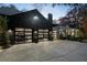 Spacious three-car garage with modern glass doors, providing ample parking and storage at 2716 Ridgewood Nw Rd, Atlanta, GA 30327