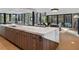 Spacious kitchen with marble island, wood cabinetry, stainless appliances, and sliding glass doors at 2716 Ridgewood Nw Rd, Atlanta, GA 30327