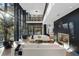 Sun-filled living room featuring a fireplace, modern decor, and soaring windows with natural light at 2716 Ridgewood Nw Rd, Atlanta, GA 30327