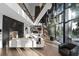 Bright living area with a fireplace, grand piano, high ceilings, and floor-to-ceiling windows at 2716 Ridgewood Nw Rd, Atlanta, GA 30327