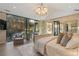 Bright main bedroom with hardwood floors, designer lighting, and floor to ceiling windows at 2716 Ridgewood Nw Rd, Atlanta, GA 30327