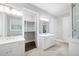 Bathroom with double vanity, walk-in closet, and herringbone floors at 3909 Collarton Close Se, Smyrna, GA 30080