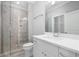 Modern bathroom with a glass shower, white vanity, and tile flooring at 3909 Collarton Se, Smyrna, GA 30080