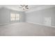 Large bedroom with ceiling fan, carpet, and ample closet space at 3909 Collarton Close Se, Smyrna, GA 30080