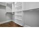 Large walk-in closet with custom shelving and rods at 3909 Collarton Close Se, Smyrna, GA 30080
