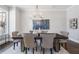 Modern dining room with dark wood table and neutral decor at 3909 Collarton Se, Smyrna, GA 30080