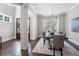 Spacious dining room with hardwood floors and a large table at 3909 Collarton Close Se, Smyrna, GA 30080
