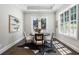 Charming dining room with round table, hardwood floors, and lots of natural light at 3909 Collarton Close Se, Smyrna, GA 30080