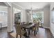 Elegant dining room with hardwood floors, chandelier, and large windows at 3909 Collarton Close Se, Smyrna, GA 30080