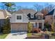 Brick two-story house with two-car garage and landscaped yard at 3909 Collarton Close Se, Smyrna, GA 30080