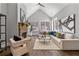 Sunken Gathering room with stone fireplace, hardwood floors, and large windows at 3909 Collarton Close Se, Smyrna, GA 30080