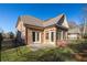 Brick home with a patio, grassy yard and black fence at 3909 Collarton Close Se, Smyrna, GA 30080
