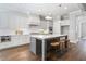 Spacious kitchen with white cabinets, granite island, and stainless steel appliances at 3909 Collarton Close Se, Smyrna, GA 30080