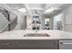 Kitchen island with white quartz countertop and stainless steel sink at 3909 Collarton Close Se, Smyrna, GA 30080